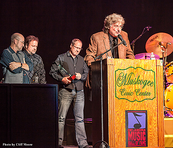 Restless Heart's Greg Jennings speaks on behalf of the band as Paul Gregg, Larry Stewart and Dave Innis look on